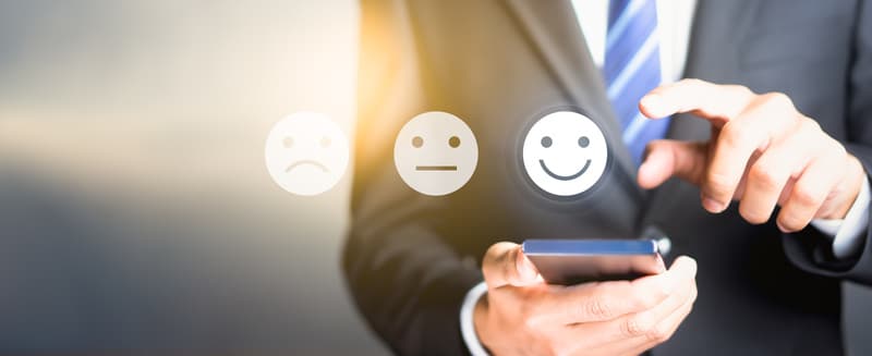 Businessman pressing happy icon, Customer service evaluation concept..