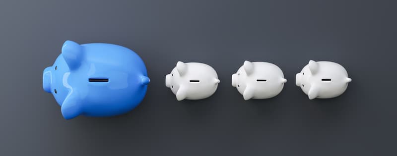 blue piggy bank as row leader, investment and development concept