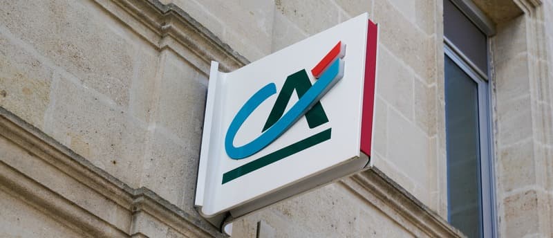 Credit Agricole sign logo on bank agency facade store office